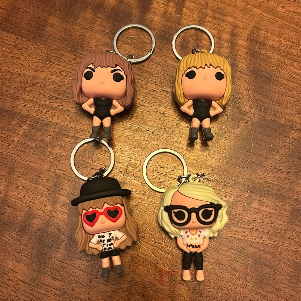 Four Taylor Swift Pop Art Keychains in box
